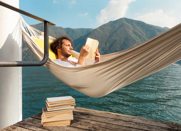 Young man on the dock of Lake — Stock Photo, Image