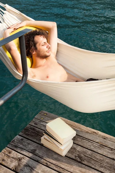 Young man on the dock of Lake — Stock Photo, Image