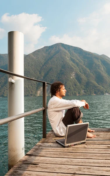 Portrait of young man at lake — Stock Photo, Image