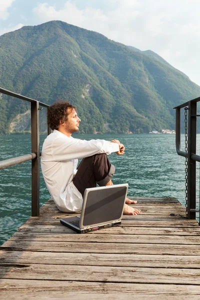 Portrait of young man at lake — Stock Photo, Image