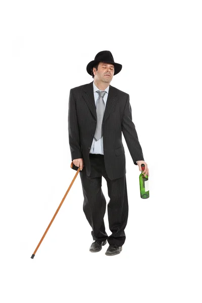 Drunk man with stick and hat — Stock Photo, Image