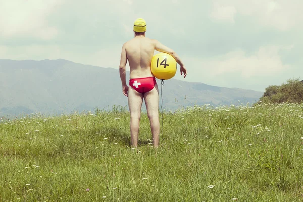 Espalda del deportista con una pelota —  Fotos de Stock