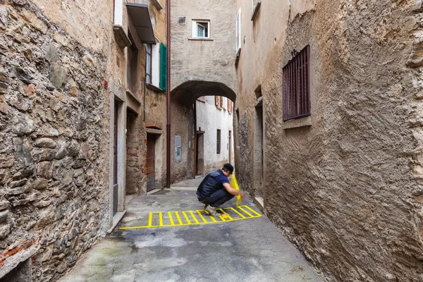 Concept of contextualization, zebra crossing in a small alley — Stock Photo, Image