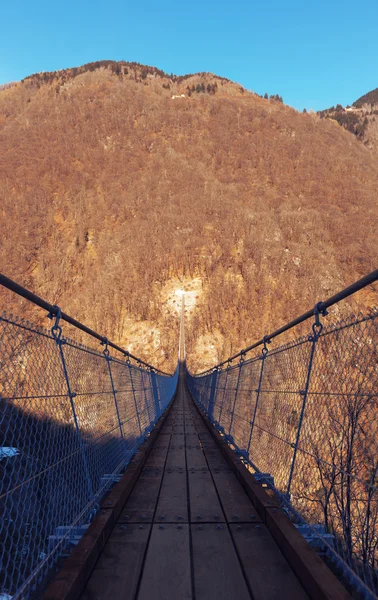 Mountain landscape with suspension bridge — Stock Photo, Image