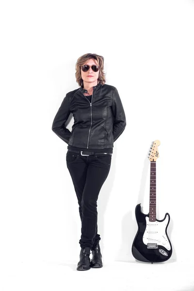 Musician dressed in black leather on white background — Stock Photo, Image