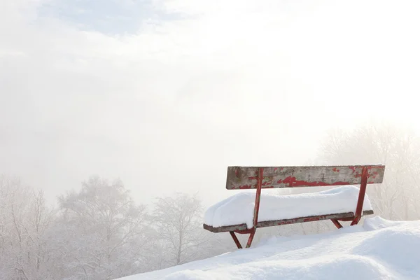 Bench in front of winter landscape — Stock Photo, Image