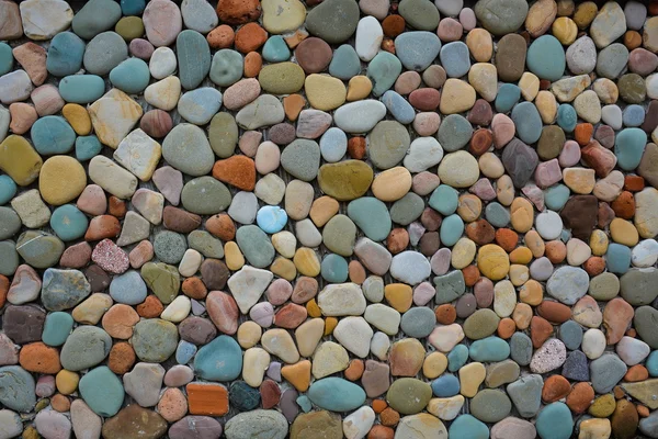 Building wall of coloured stones — Stock Photo, Image