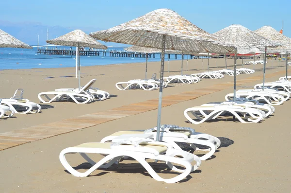 Beach chairs on sand beach with  blue sky — Stock Photo, Image