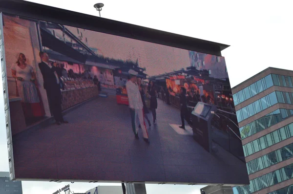 Opening ceremony of the new Markthal on 01 October 2014 in Rotterdam, Netherlands. on big street tv screen — Stock Photo, Image