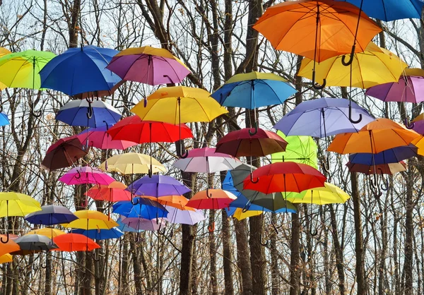 Multicolored umbrellas up in the sky. Rainbow Colors. — Stock Photo, Image
