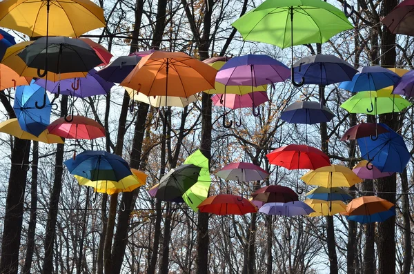 Multicolored umbrellas up in the sky. Rainbow Colors. — Stock Photo, Image