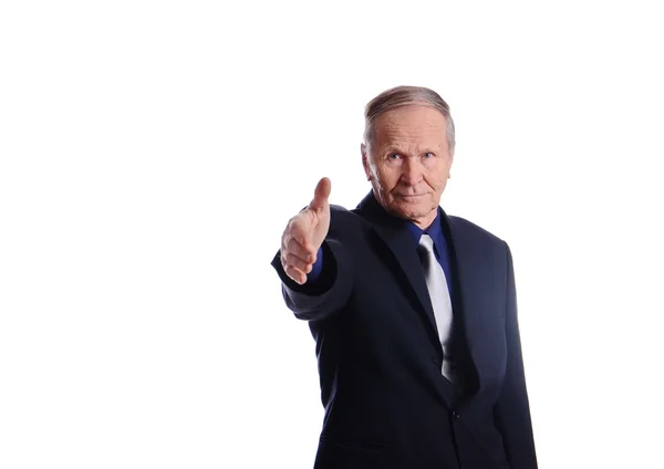 Serious businessman giving hand for a handshake — Stock Photo, Image