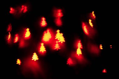Bokeh noel ağacı şeklinde. Yeni yıl geçmişi. Seçici odak.