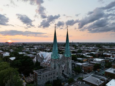 Sunset aerial view of church spires over Montreal cityscape. g.