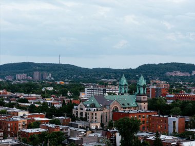 Sunset aerial view of church spires over Montreal cityscape. g.