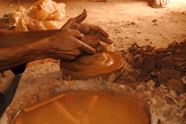 Potter in the village of Tamegroute next to the Sahara desert, Morocco clipart