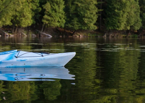 Kayak on a Calm Bay in Summertime Royalty Free Stock Photos