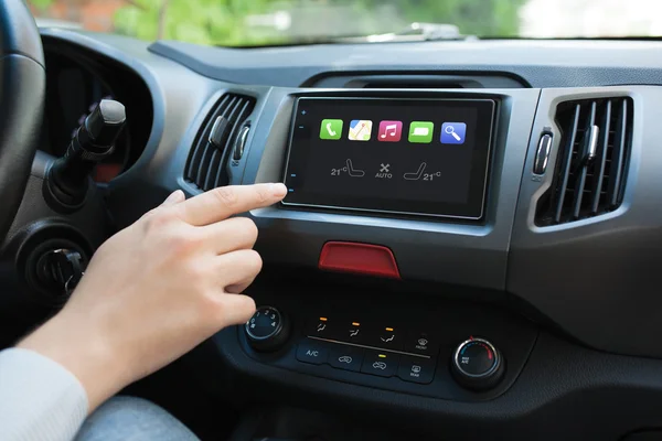 Man hand touching to screen multimedia system with Auto Play — Stock Photo, Image