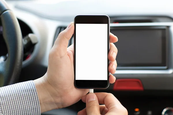 Man in a saloon car holding the phone — Stock Photo, Image