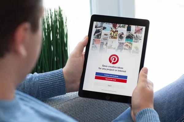 Man holding iPad Pro Space Gray social Internet service Pinteres