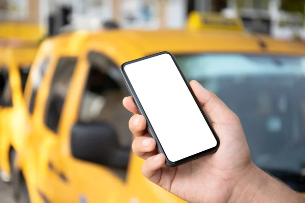 Male Hand Holding Phone Isolated Screen Background Yellow Taxi Cars — Stock Photo, Image