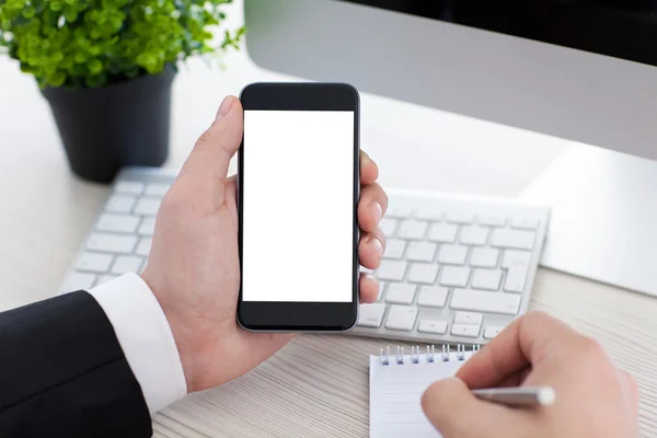 Businessman holding phone with isolated screen and writing in no — Stock Photo, Image
