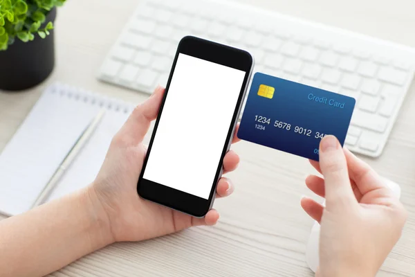 Female hands holding phone with isolated screen and credit card — Stock Photo, Image