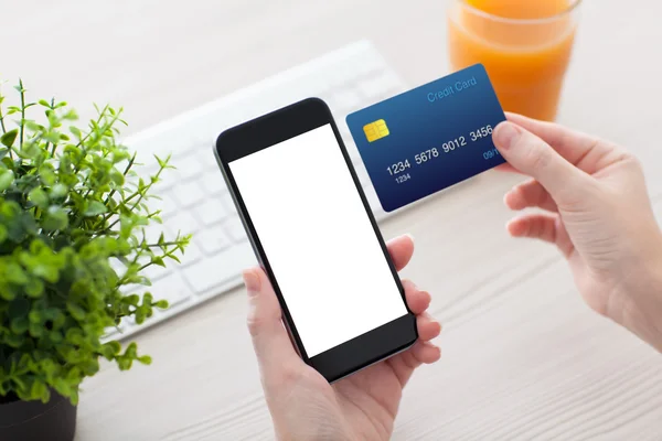 Female hands holding phone with isolated screen and credit card — Stock Photo, Image