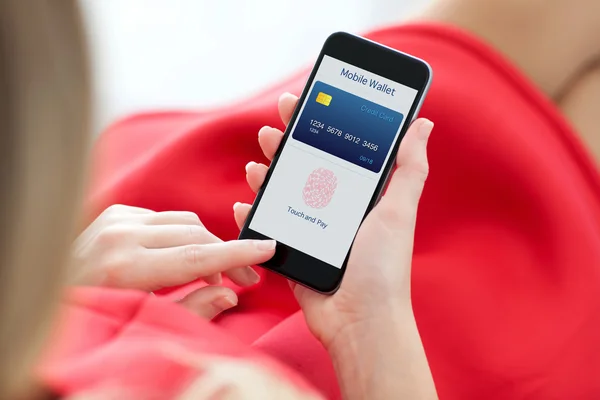 Woman holding phone with fingerprint for online shopping — Stock Photo, Image