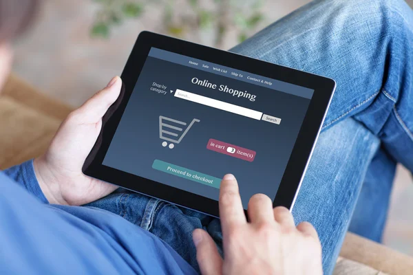 Man making online shoppind on a tablet — Stock Photo, Image