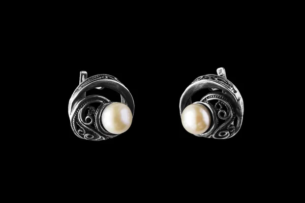 Earrings on black — Stock Photo, Image