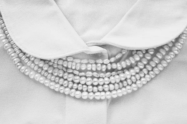 Pearl on blouse — Stock Photo, Image