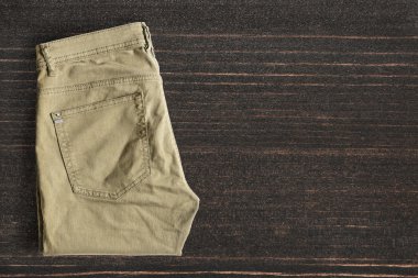 Pants on wooden background clipart