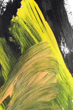 Sarı ve siyah soyut boya vuruşları bir arka grond olarak