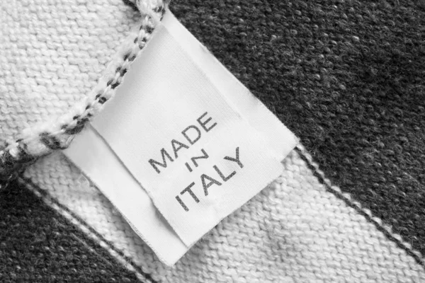 Clothing Label Says Made Italy Knit Background Closeup — Stock Photo, Image