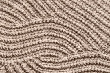 Arkaplan olarak bej yün örgü örme