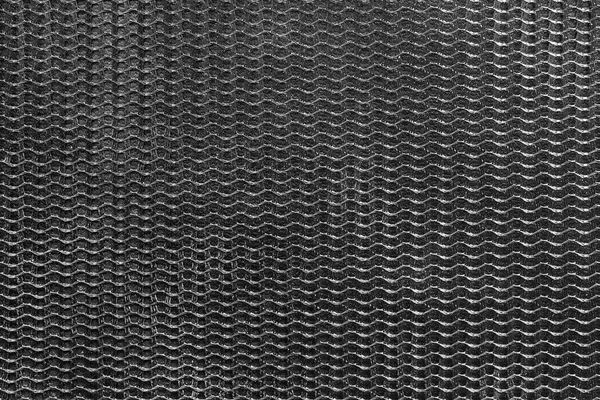 Black synthetic fiber netting closeup as a background