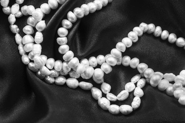 Pearl on silk — Stock Photo, Image