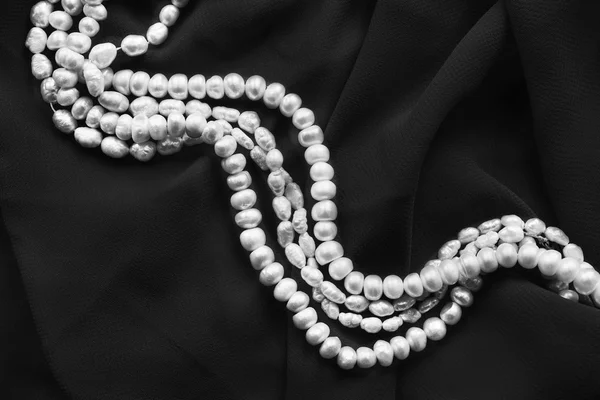 Pearl on silk — Stock Photo, Image