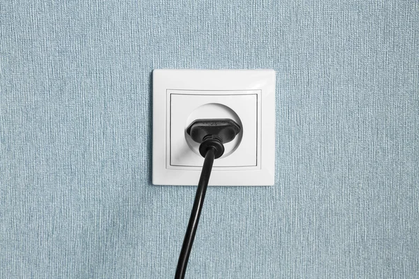 Power plug in a socket — Stock Photo, Image