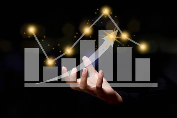 Businessman holding graph finance chart. Digital business hologram graph finance chart background. For the business and finance concept.