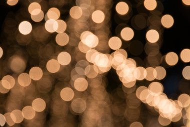 Altın soyut bokeh ışıkları. Odaklanmamış arkaplan.