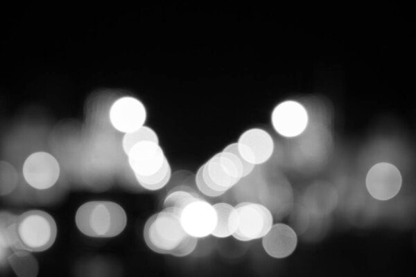 Abstract bokeh lights. defocused background - black and white tone.