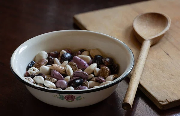 Multicolored Beans Enamel Cup Put Wooden Table — Stock Photo, Image