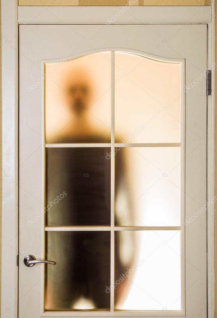 Man behind the Glass Door