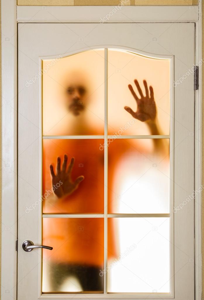 Man behind the Glass Door