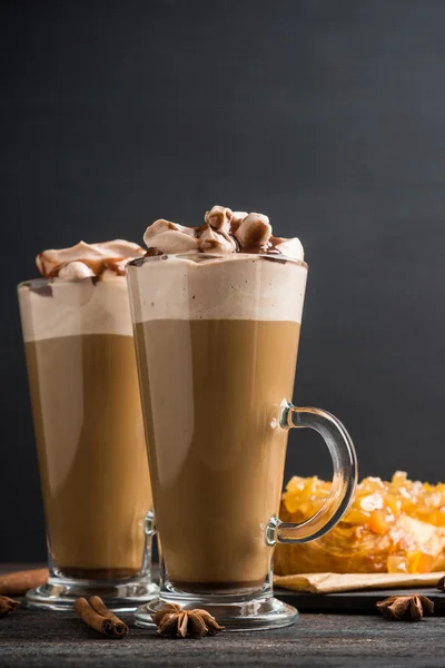 Coffee in glass on the dark wooden table — Stock Photo, Image