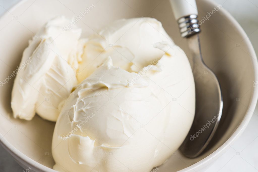 Fresh mascarpone in white bowl