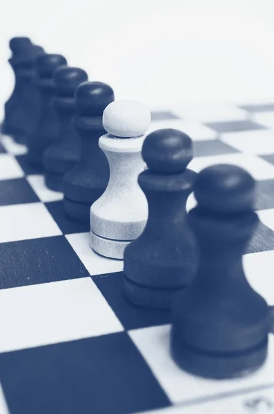 Troop pawns on a chessboard. — Stock Photo, Image