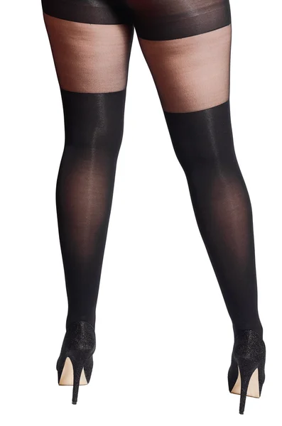 Vackra sexiga kvinnliga ben i svarta tights med en fjäril — Stockfoto